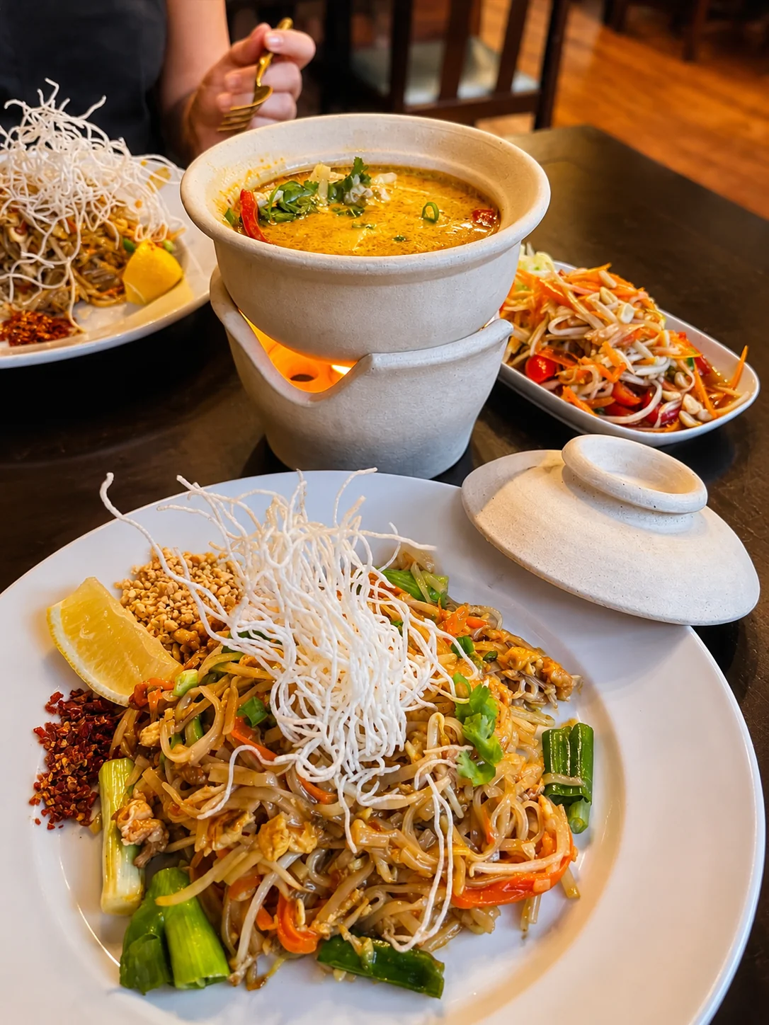Pad Thai and curry hot pot served with a fresh salad